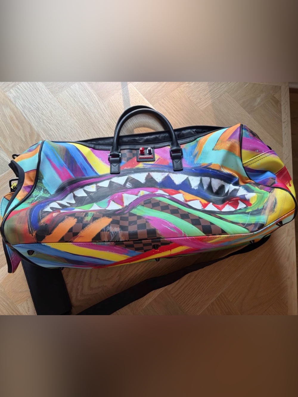 Discontinued SPRAYGROUND shark graffiti regular size duffle bag.